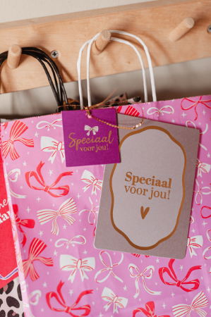 Roze papieren tas rode/witte strikken 22x31cm - Cadeautas